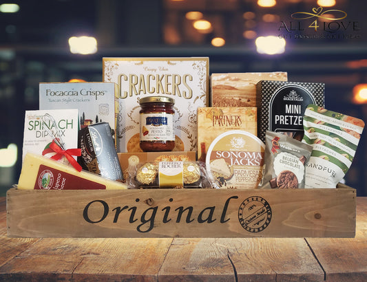 Wooden crate with crackers, cheese, dips and treats