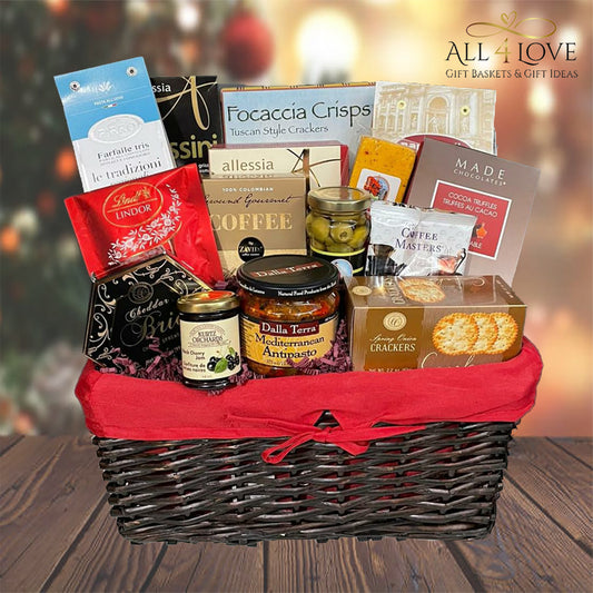 Black wicker basket filled with crackers, dips, coffee, chocolate