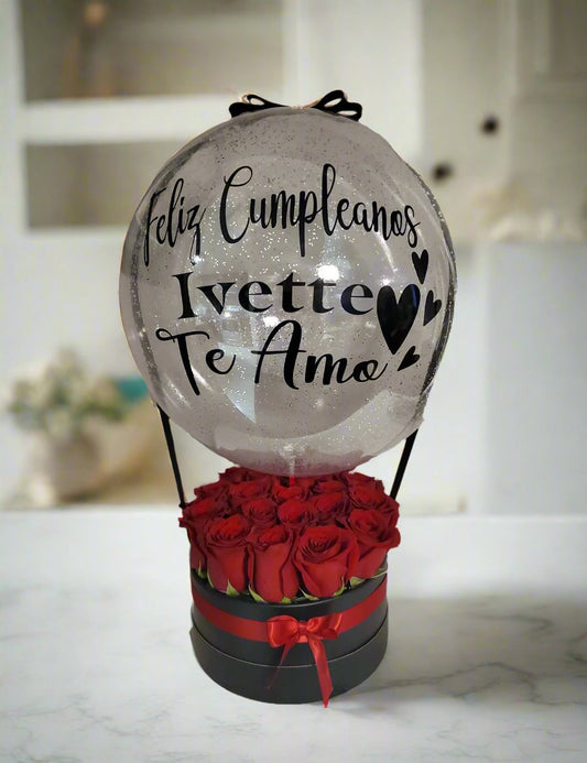 Clear globe over red roses shaped like hot air balloon